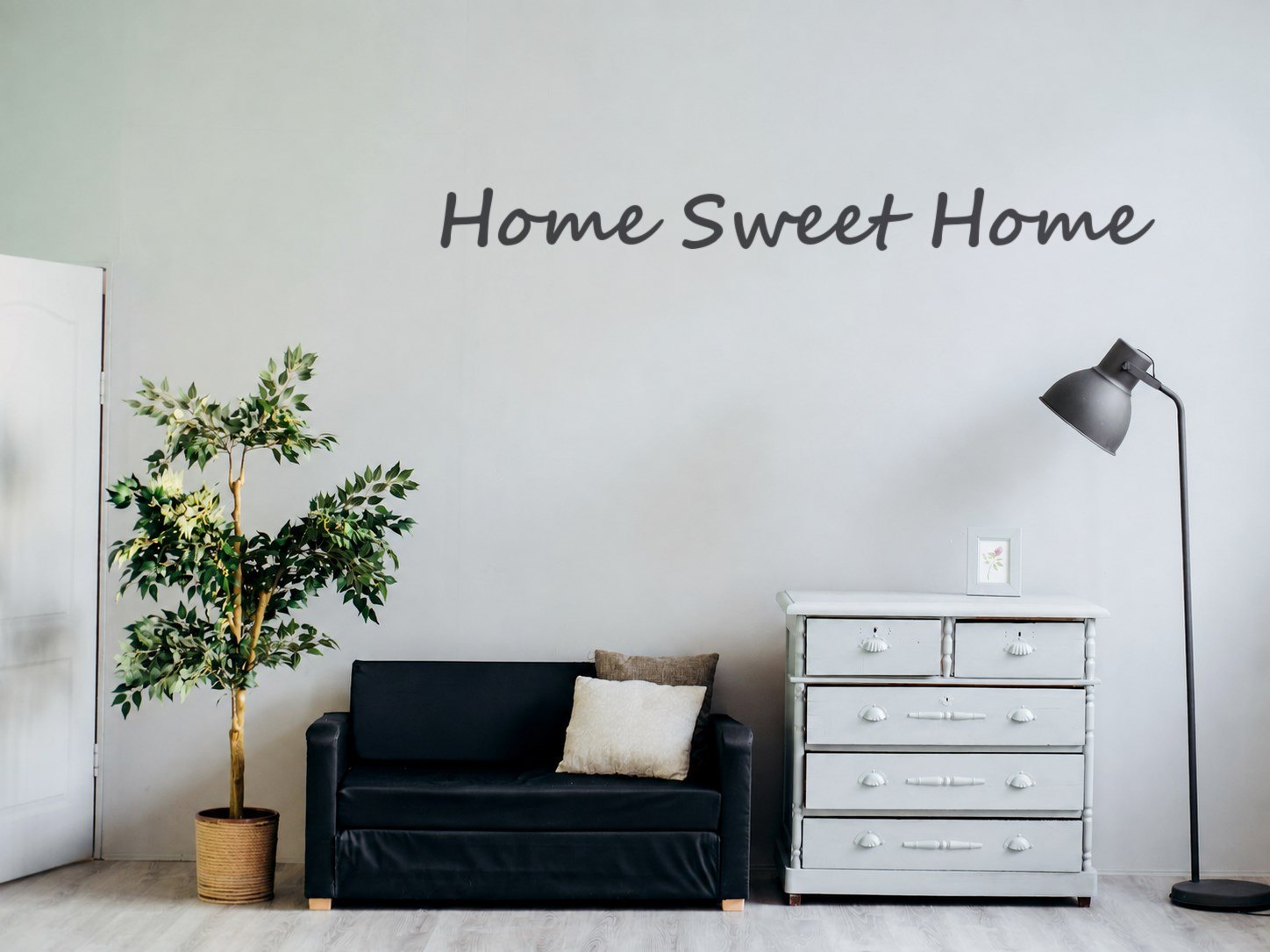 Living room wall with a Home Sweet Home decal